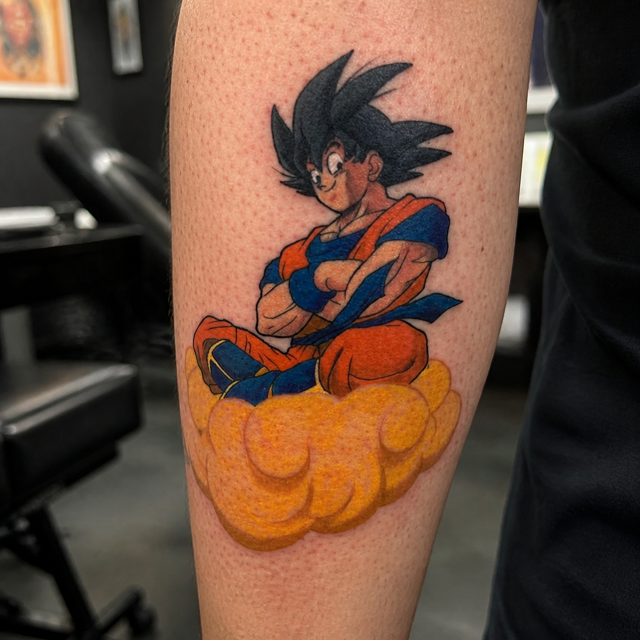 Goku tattoo on an arm at South Town Tattoo Collective