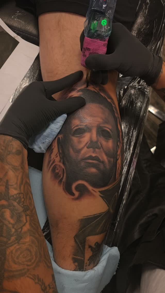 Michael Myers portrait tattoo being applied